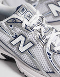 New Balance 740 trainers in navy and white