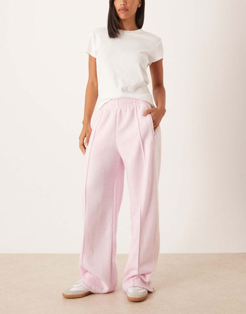 adidas Originals Firebird fluffy track pants in pink, front view