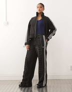adidas Originals firebird denim jeans in black, front view