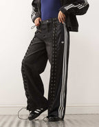 adidas Originals firebird denim jeans in black, side view