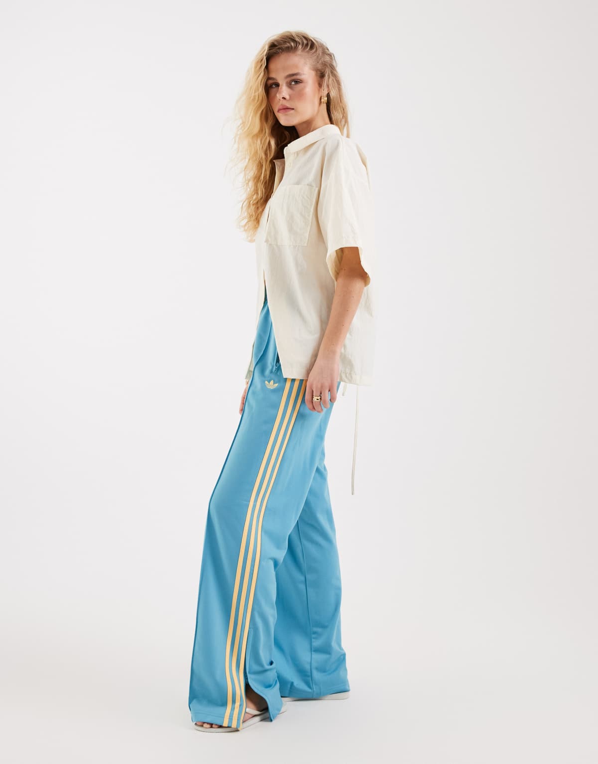 adidas Originals Firebird loose track pants in turquoise and yellow, front view