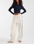 adidas Originals terry towel track pants in cream white, front view