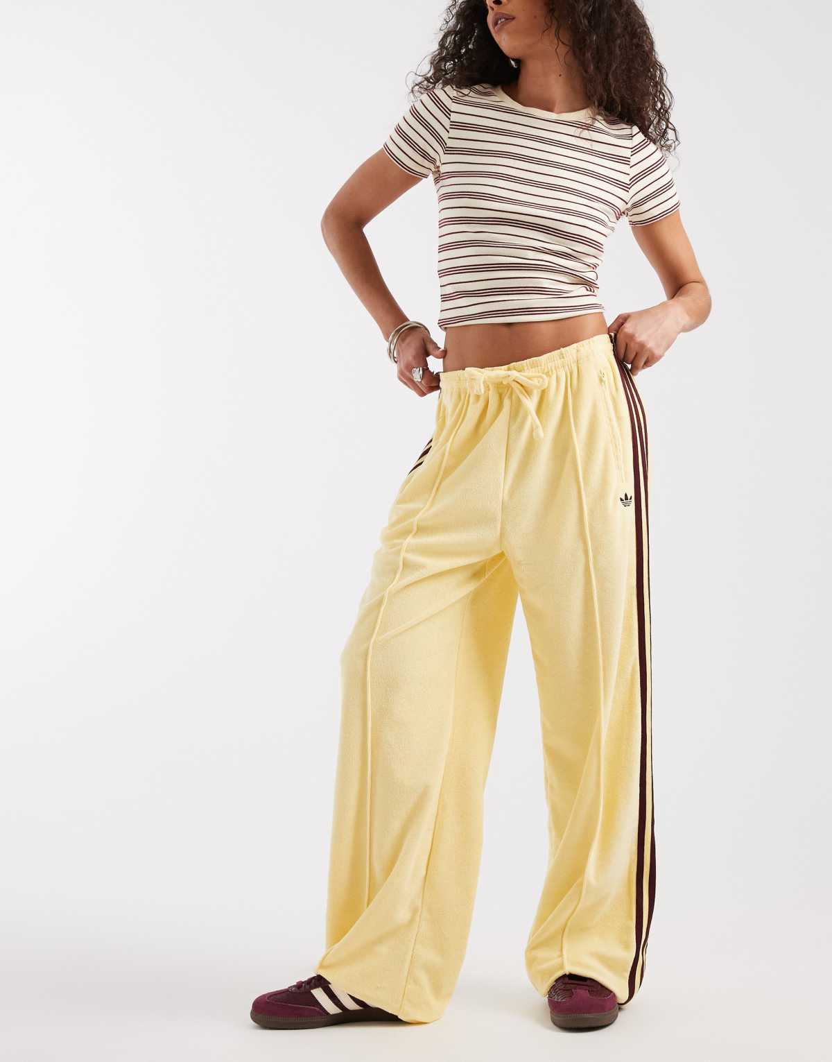 adidas Originals terry towel track pants in yellow, front view