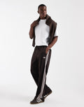 adidas Originals Firebird track pants in coffee brown, front view