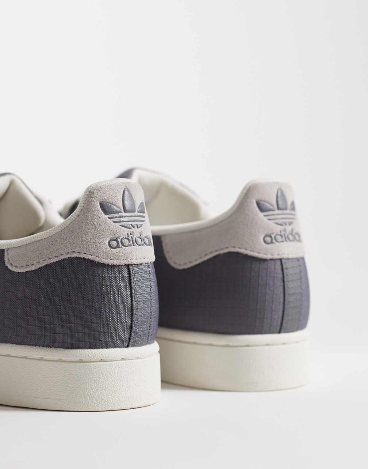 adidas Originals Superstar II trainers in grey and white, side view