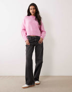 ASOS DESIGN boxy crew neck jumper in pink, side view