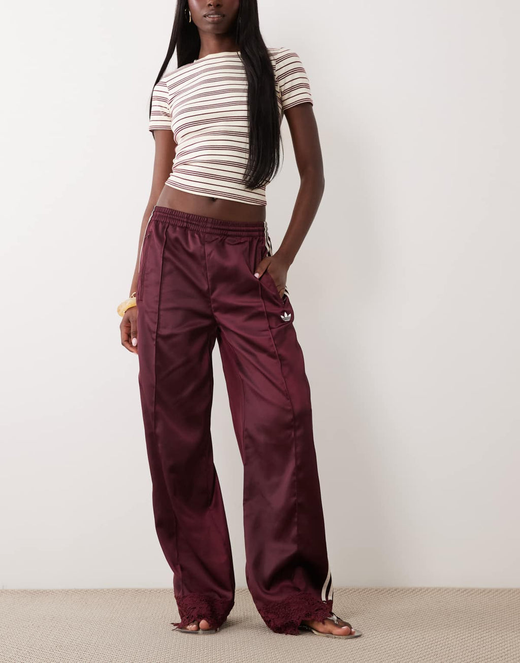 adidas Originals satin Firebird track pants in burgundy, front view