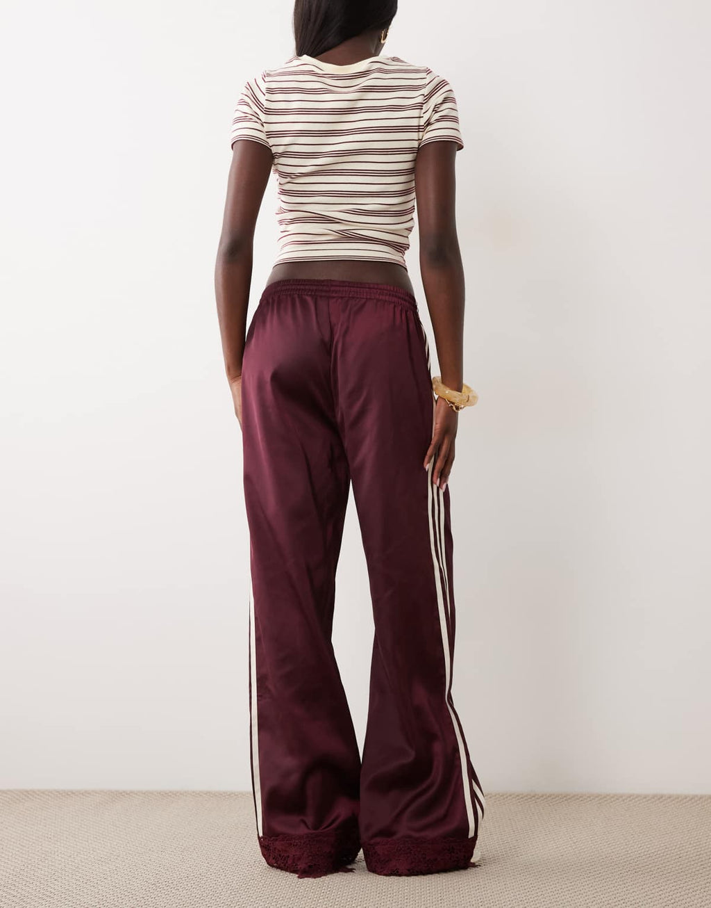 adidas Originals satin Firebird track pants in burgundy, side view
