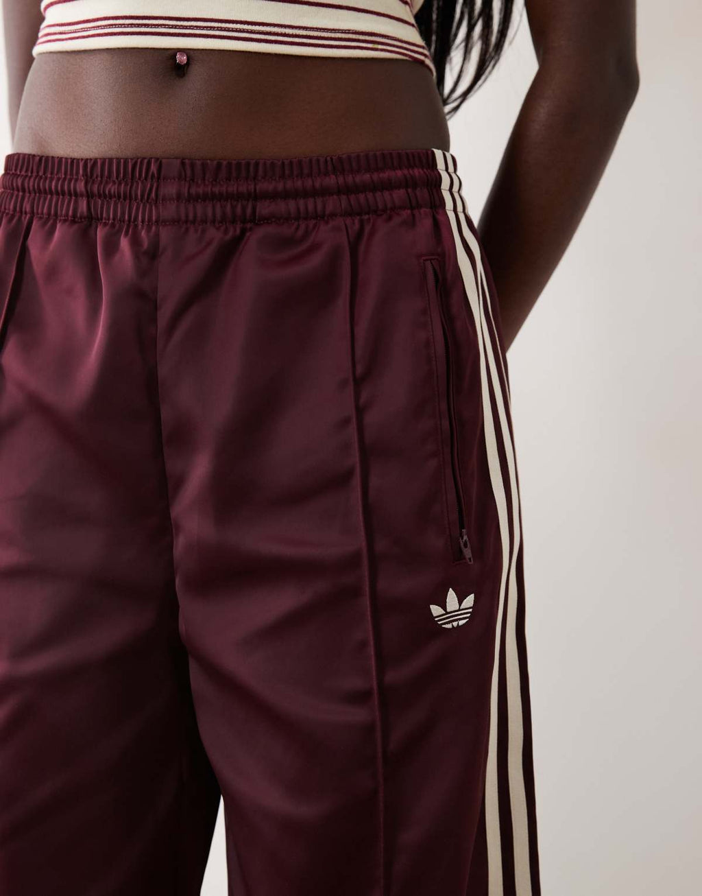 adidas Originals satin Firebird track pants in burgundy, full length view