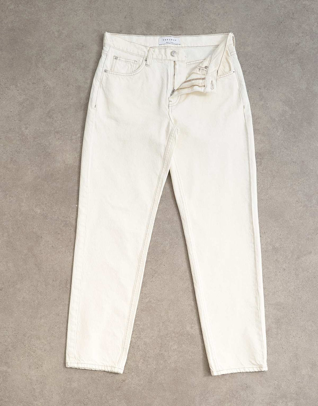 Topshop Runway mid rise straight jean in bone, detail of ankle taper