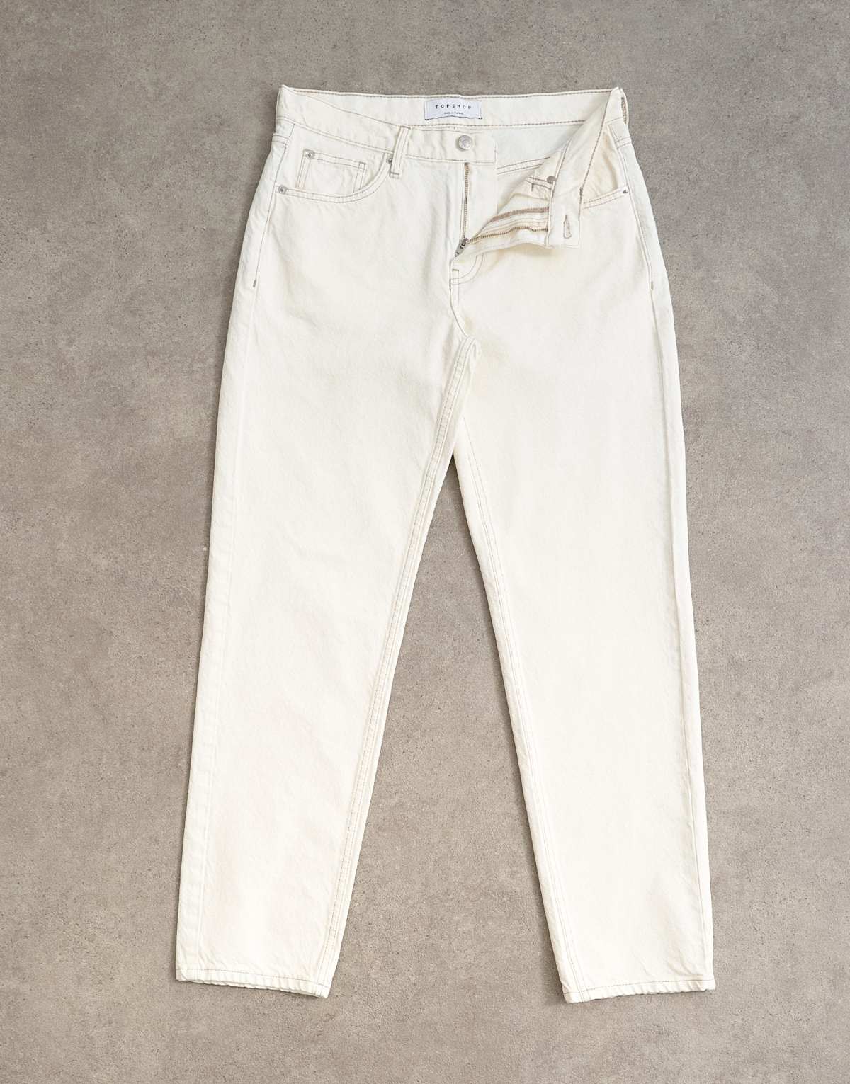 Topshop Runway mid rise straight jean in bone, detail of ankle taper