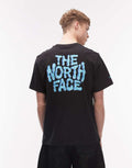 The North Face Drip Logo relaxed backprint t-shirt in black, front view