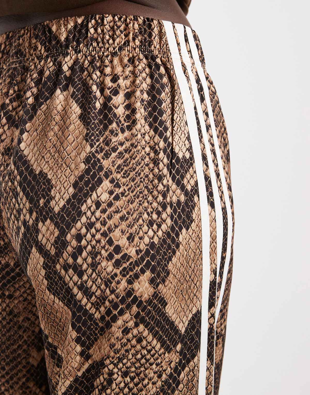 adidas Originals wide leg satin track pants in light brown snake, full length view