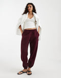 adidas Originals essential joggers in maroon, front view