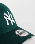 New Era NY Yankees 9FORTY essential cap in dark green, side view