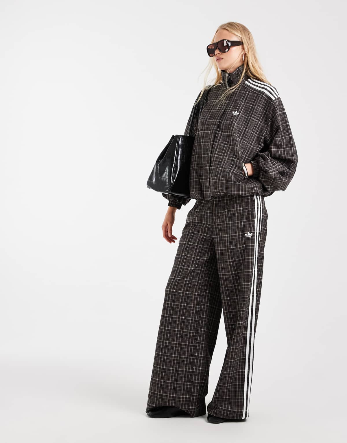 adidas Originals check track bottoms in night brown, front view