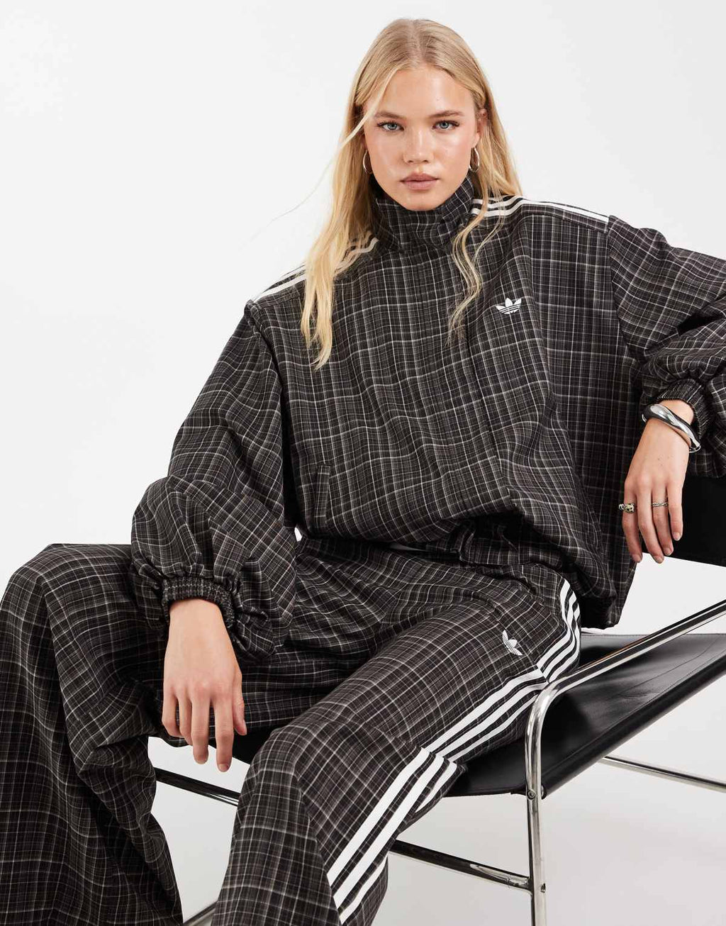 adidas Originals check track bottoms in night brown, side view