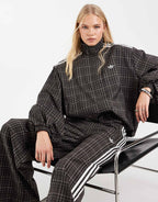 adidas Originals check track bottoms in night brown, side view