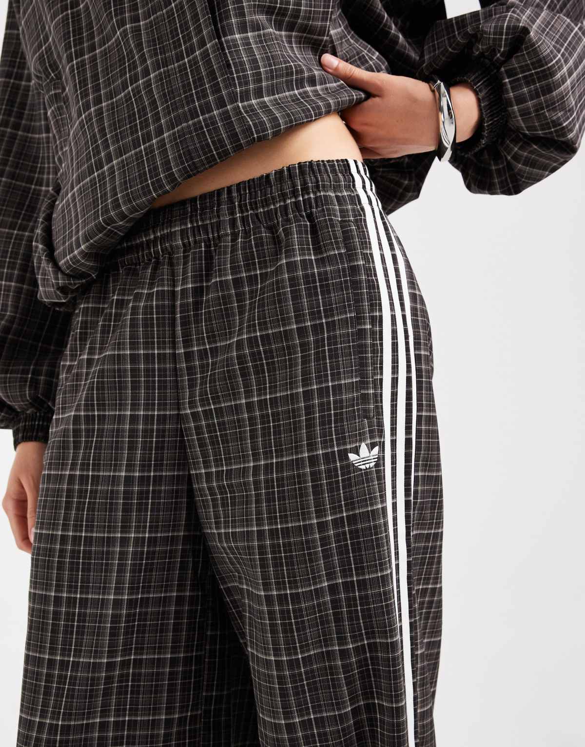adidas Originals check track bottoms in night brown, detail view