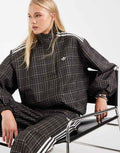 adidas Originals check track top in night brown, front view
