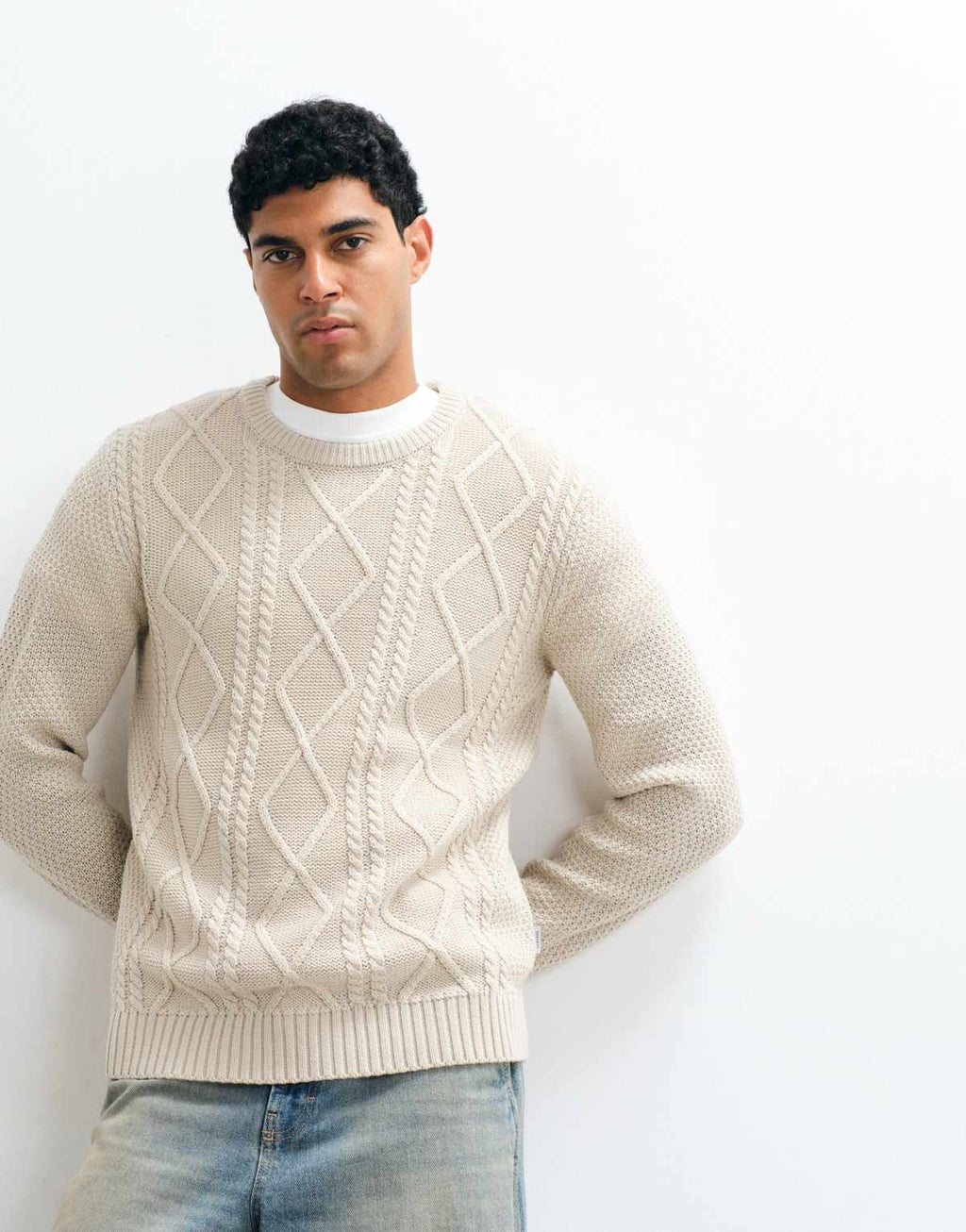 JJ Rebel cable knit jumper in cream, front view