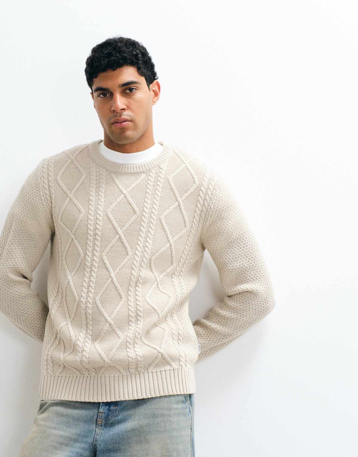 JJ Rebel cable knit jumper in cream, front view