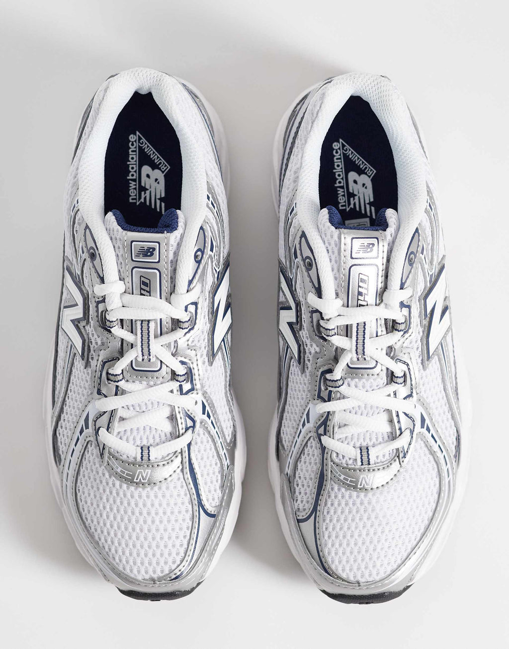 New Balance 740 trainers in navy and white