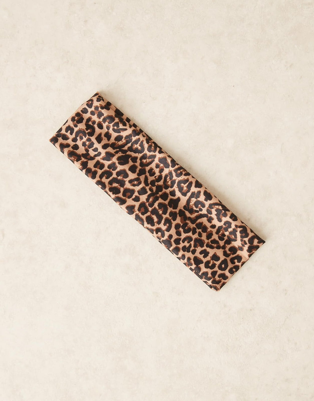 Wide jersey headband in leopard print, worn view