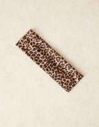 Wide jersey headband in leopard print, worn view