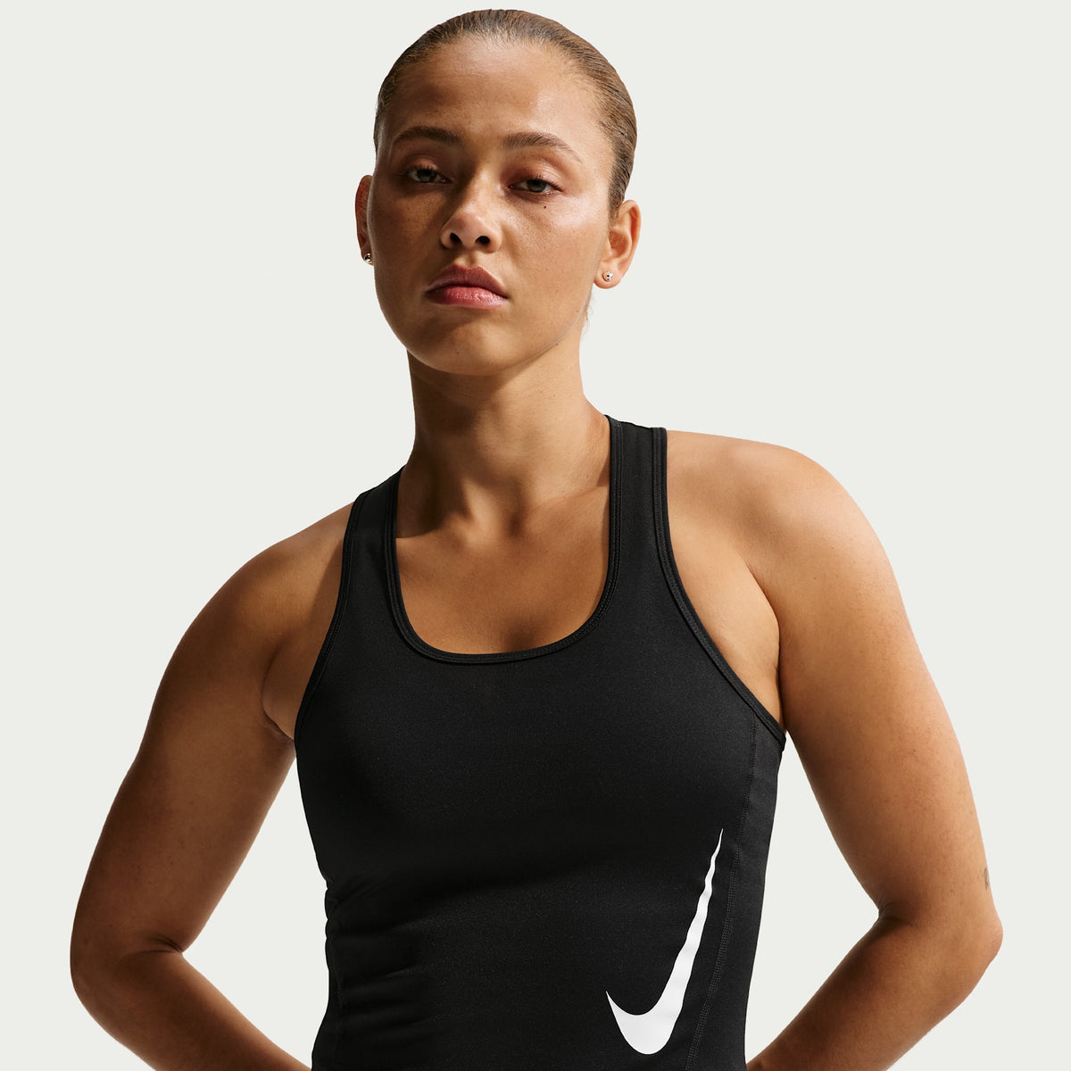 Nike Tempo Swoosh women's Dri-FIT running tank top in black/white, front view