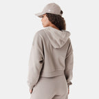 New Era women's Arch Wordmark cropped hoodie in beige, side view