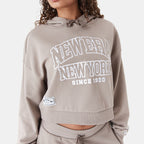 New Era women's Arch Wordmark cropped hoodie in beige, hood detail